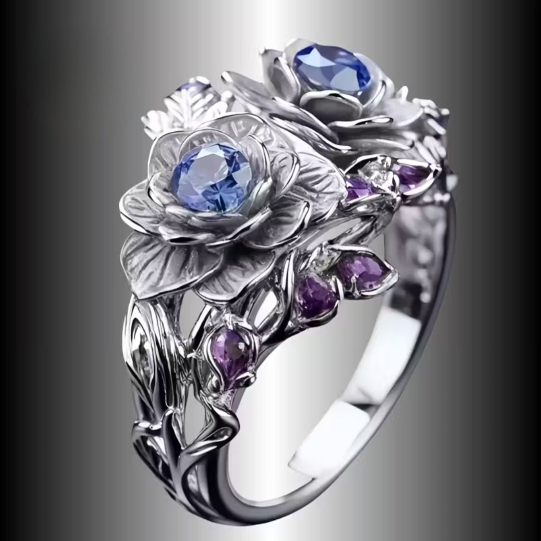 Zilverkleurige ring met twee bloesems