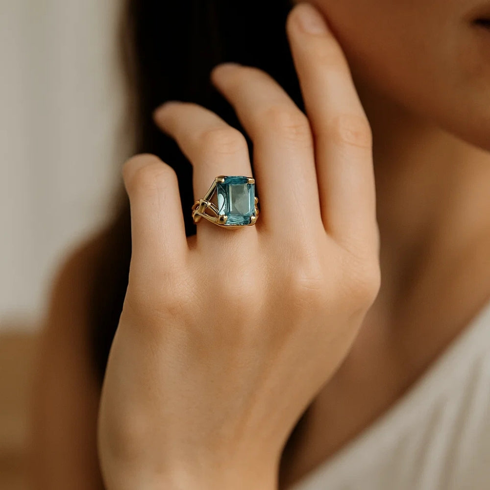 Oval Blue Zirconia Ring with Woven Gold-Tone Band