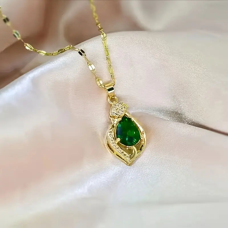 Ketting met bladhanger met groene steen in goudkleur