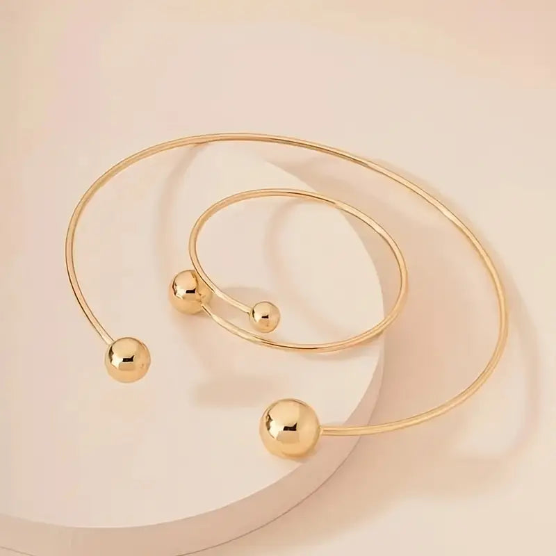 Minimalistische set van collier en open armband in twee metaaltinten