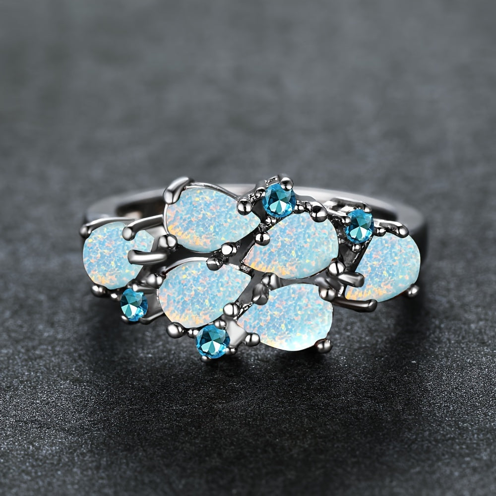 Klassieke clusterring met waterdruppels in opaallook in drie kleuren