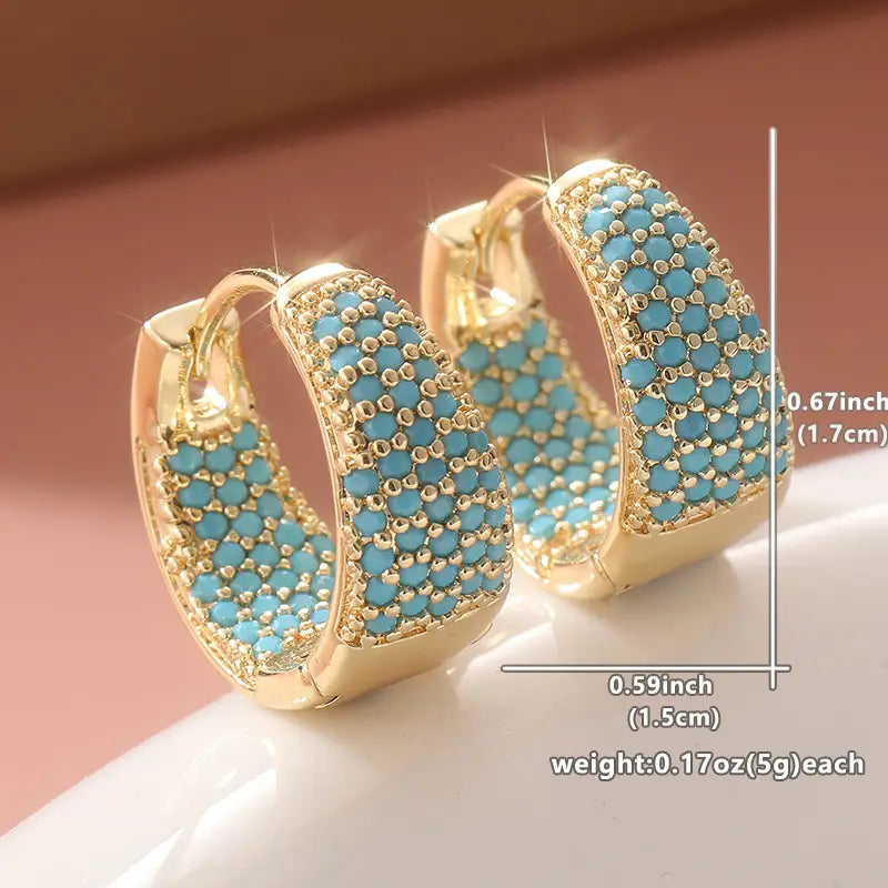 Goudkleurige oorringen met turquoise kralen