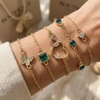 Armbandenset met opengewerkt hart en groen kristal