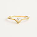 Goudkleurige ring met één parel