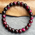Kralenarmband met stenen in granaatlook