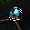 Round Moonstone-Look Ring with Dark Openwork Band