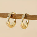 Twisted Gold-Tone Hoop Earrings with Pavé Crystal Accents