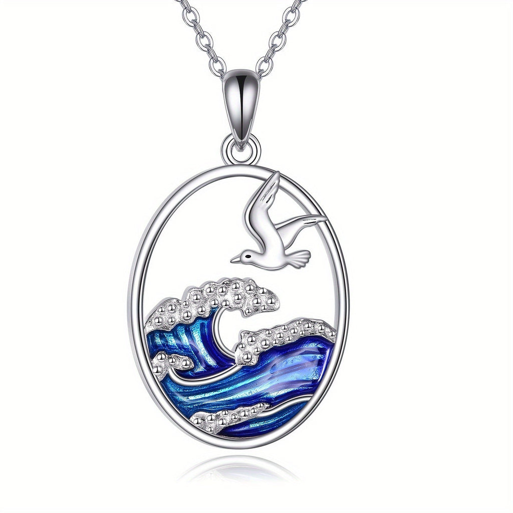 Zilverkleurige ketting met hanger met oceaangolf en meeuw
