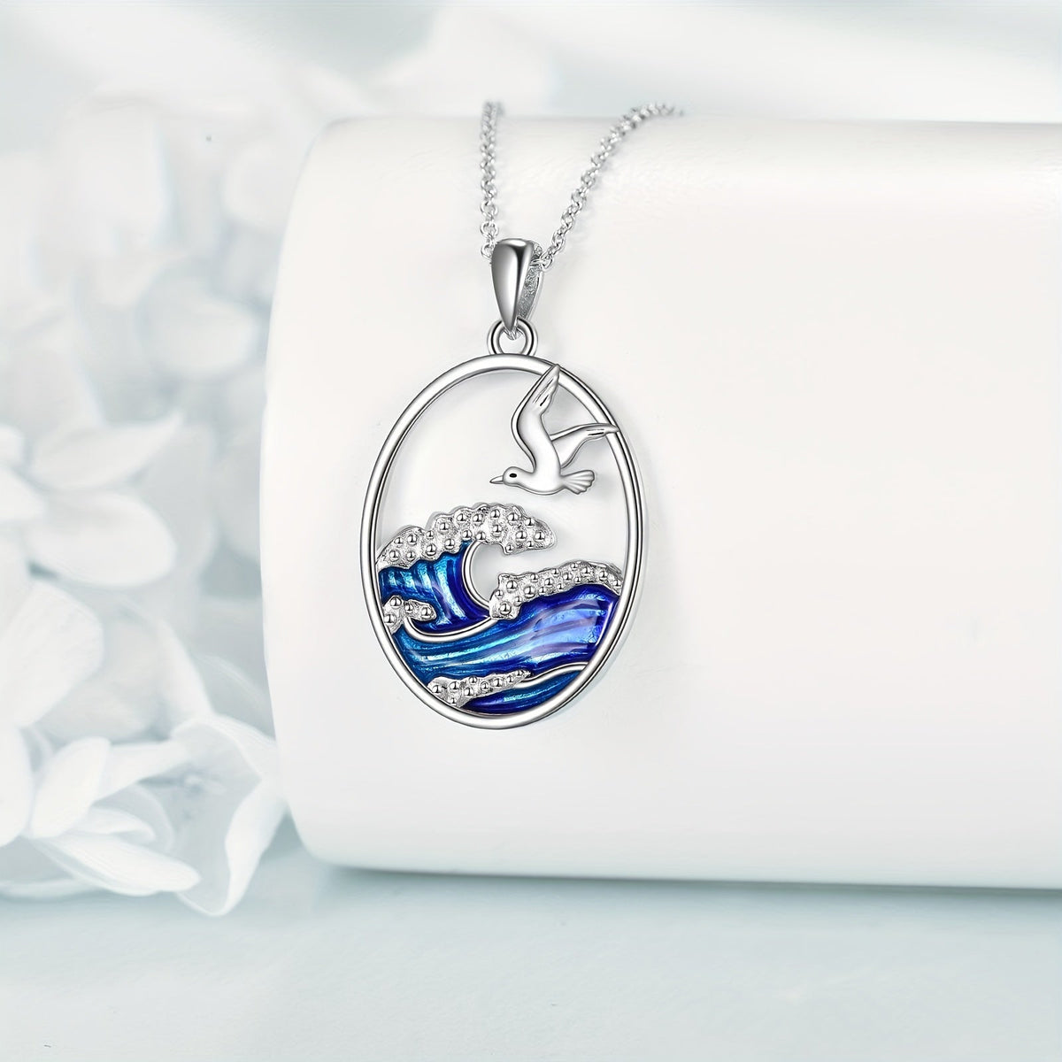 Zilverkleurige ketting met hanger met oceaangolf en meeuw
