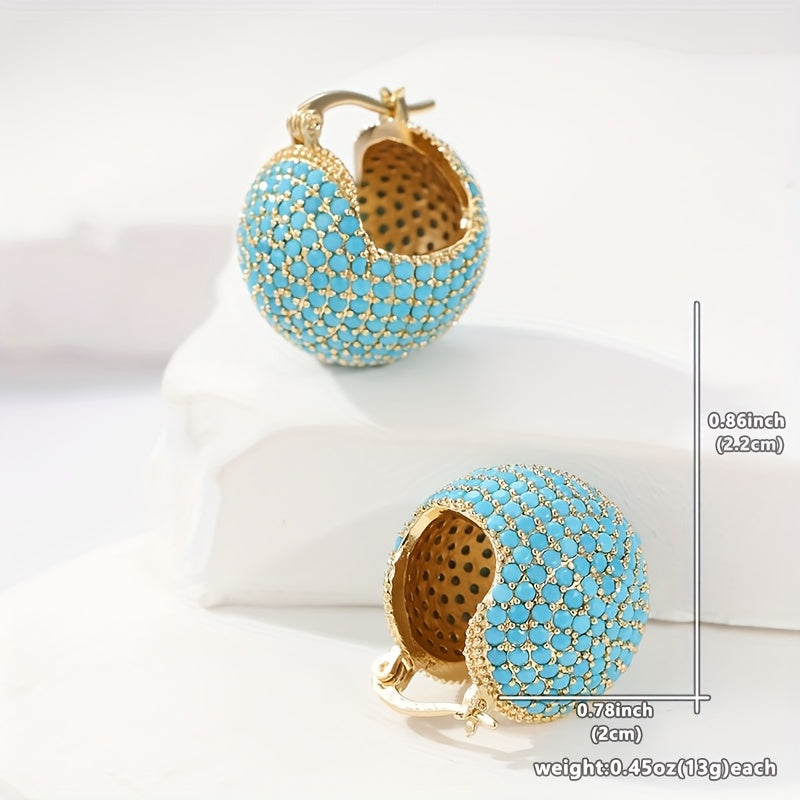 Retro goudkleurige oorringen met turquoise koepel