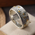 Retro tweekleurige ring in etnische stijl met bloem en gras