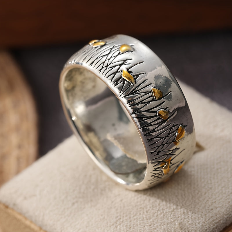 Retro tweekleurige ring in etnische stijl met bloem en gras