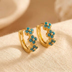 Oorringen met turquoise bloem