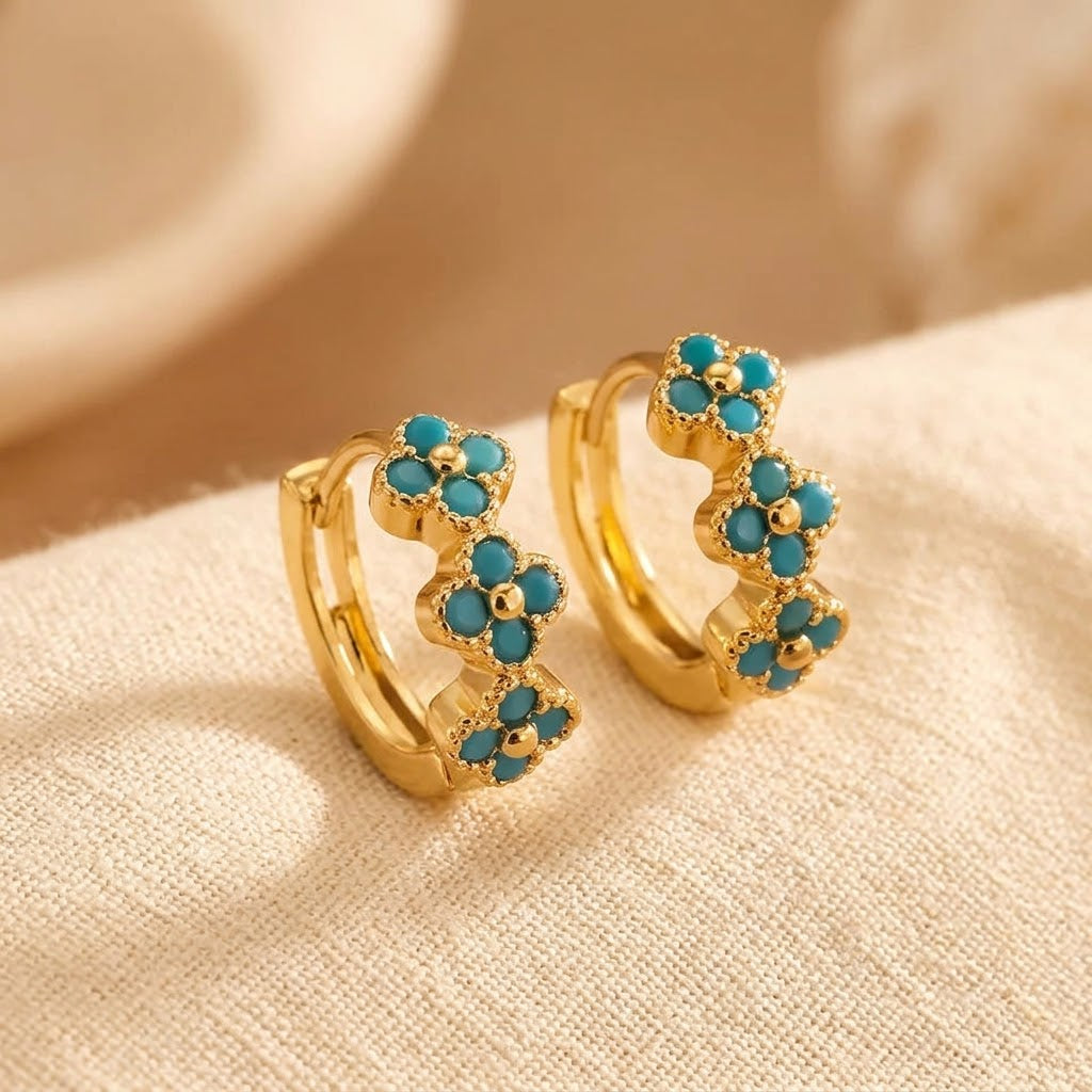 Oorringen met turquoise bloem
