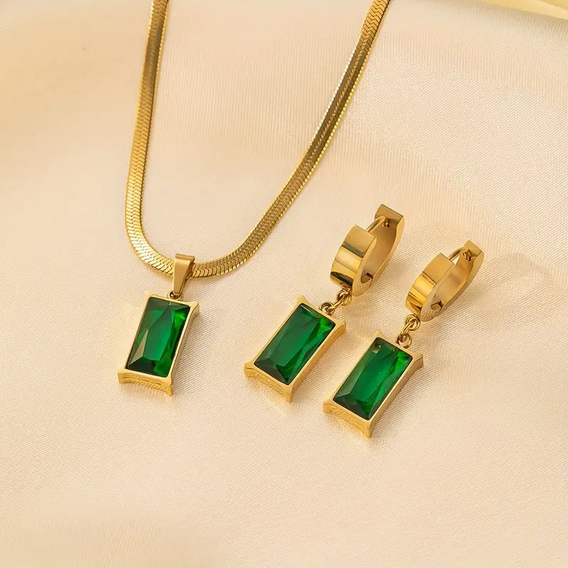 Set met slangenketting en oorbellen met groene steen in goudkleur