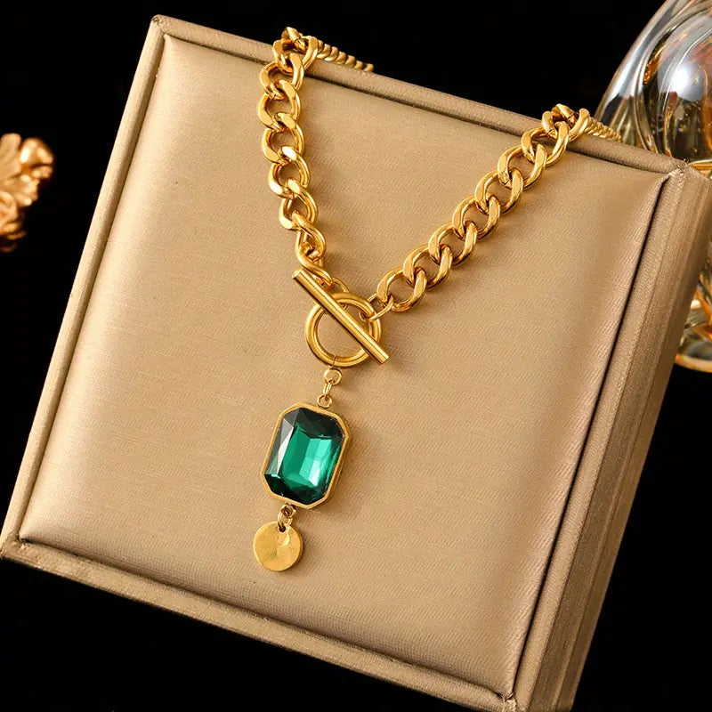 Grove schakelketting met smaragdlook-hanger in goudkleur