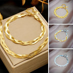 Set met slangenketting en armband in goudkleurig staal