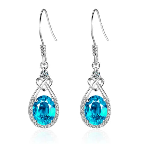 Blauwe ovale oorhangers met halo