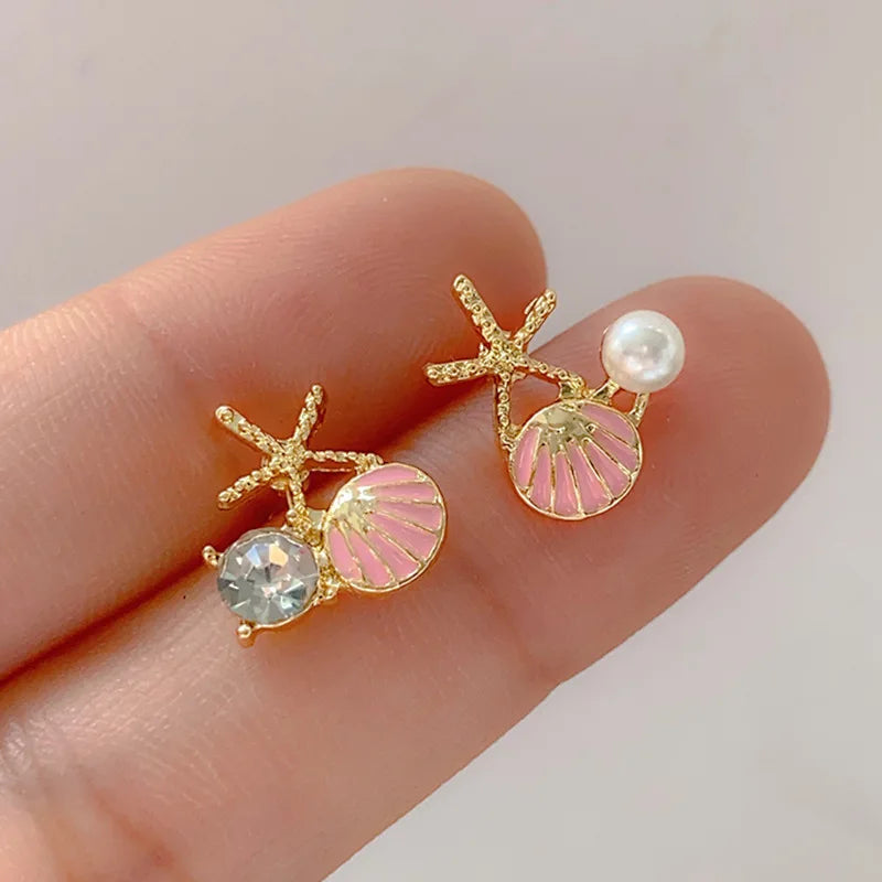 Zeesteroorbellen met schelp- of pareldetail