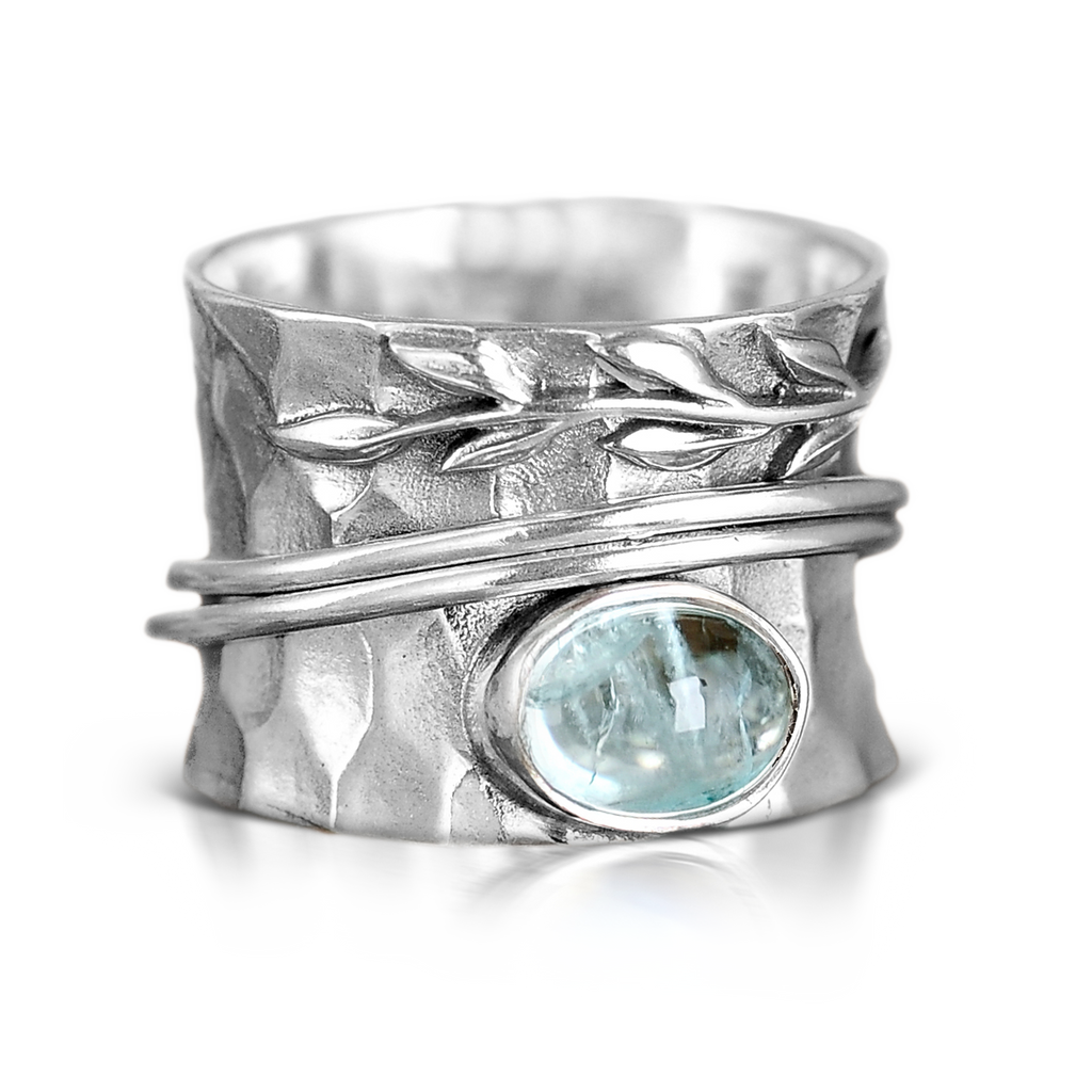 Ambachtelijke zilverkleurige spinnerring met blad in aquamarijnlook
