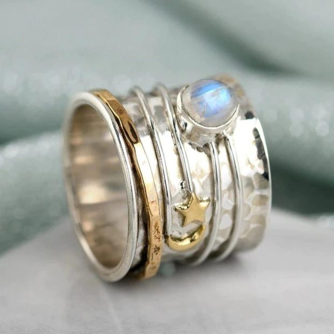 Spinnerring met ster, maan en maansteen