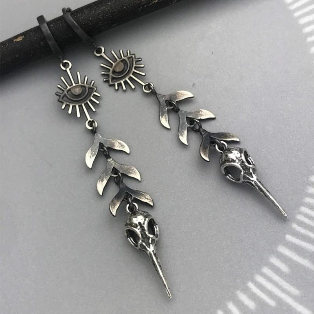 Boho oorbellen met maskerhanger in zilverkleur