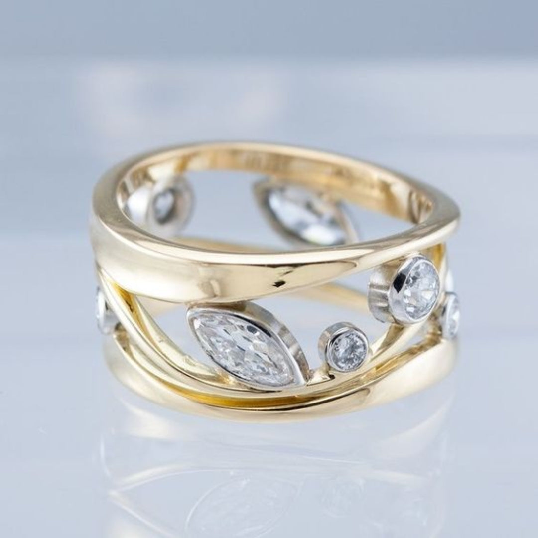 Tofarvet åben ring med zirkoniablade