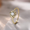 Goudkleurige ring met kristallen rozet op smalle band
