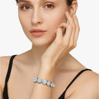 Kristallen tennisarmband met hangende hartbedels
