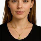 Goudkleurige ketting met ring en draaiende zirkonia bloem