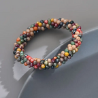 Armband met veelkleurige gefacetteerde kralen en spiraaldesign