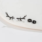 Hertengewei-oorknopjes