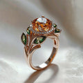 Goudkleurige ring met oranje kristal