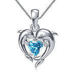 Ketting met twee dolfijnen en blauw hart