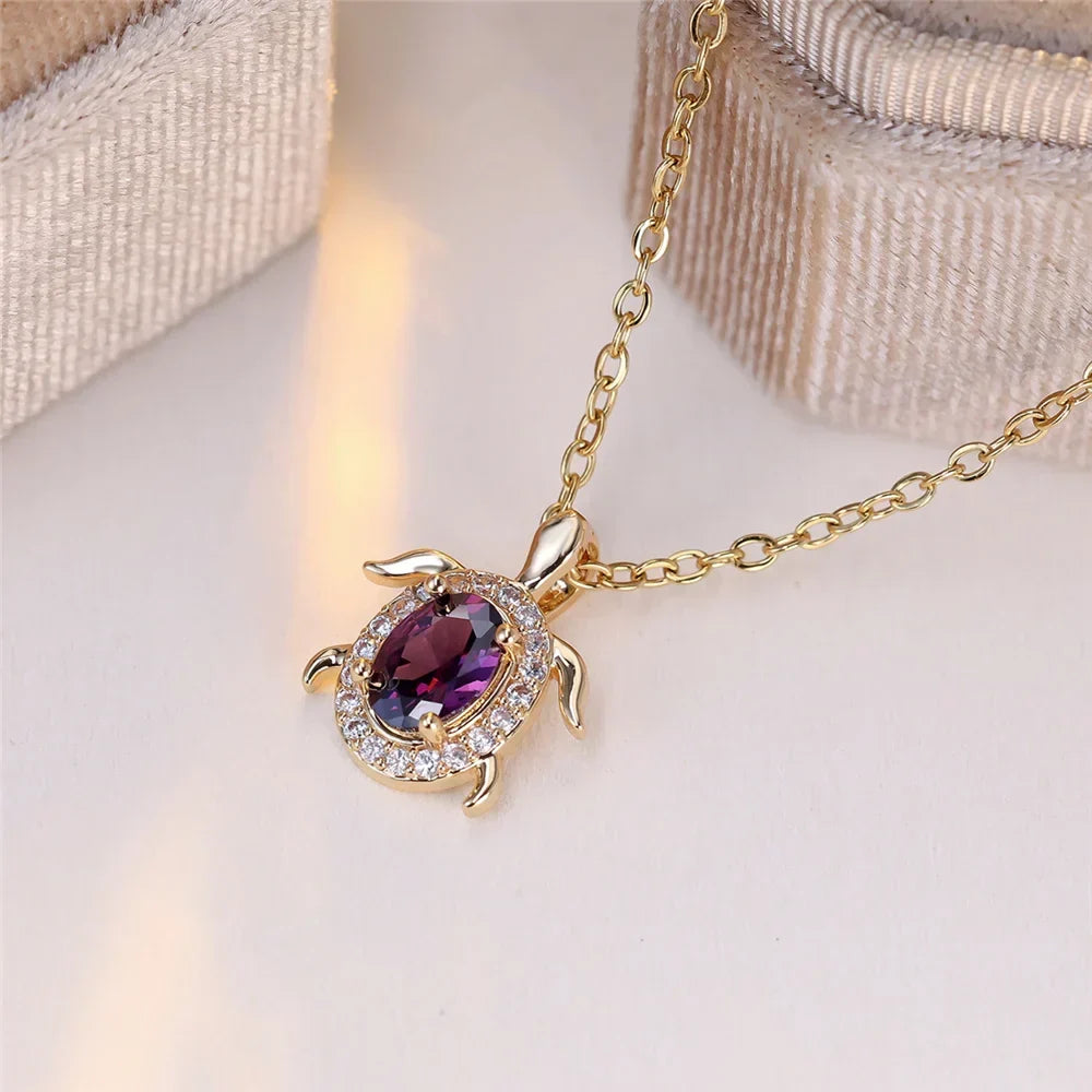 Ketting met schildpadhanger van paars kristal