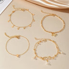 Set parel-enkelbandjes met vlinder-, ster- en hartbedels