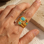 Goudkleurige draadring met twee turquoise stenen, statement