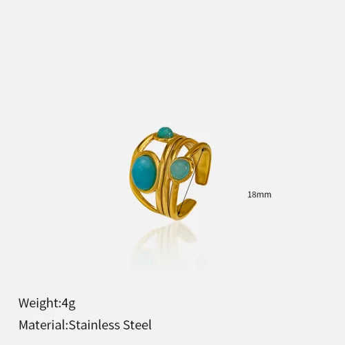 Goudkleurige draadring met twee turquoise stenen, statement