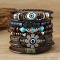 Meerstrengse armbandenstapel met oogkralen