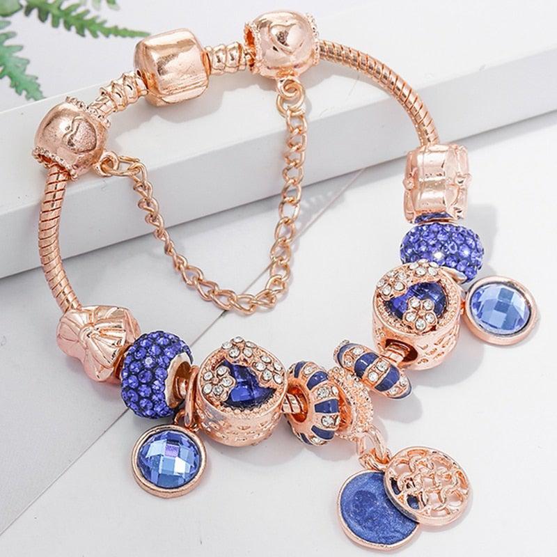 Roze zilverkleurige armband met blauw kristal