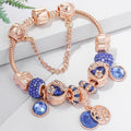 Roze zilverkleurige armband met blauw kristal