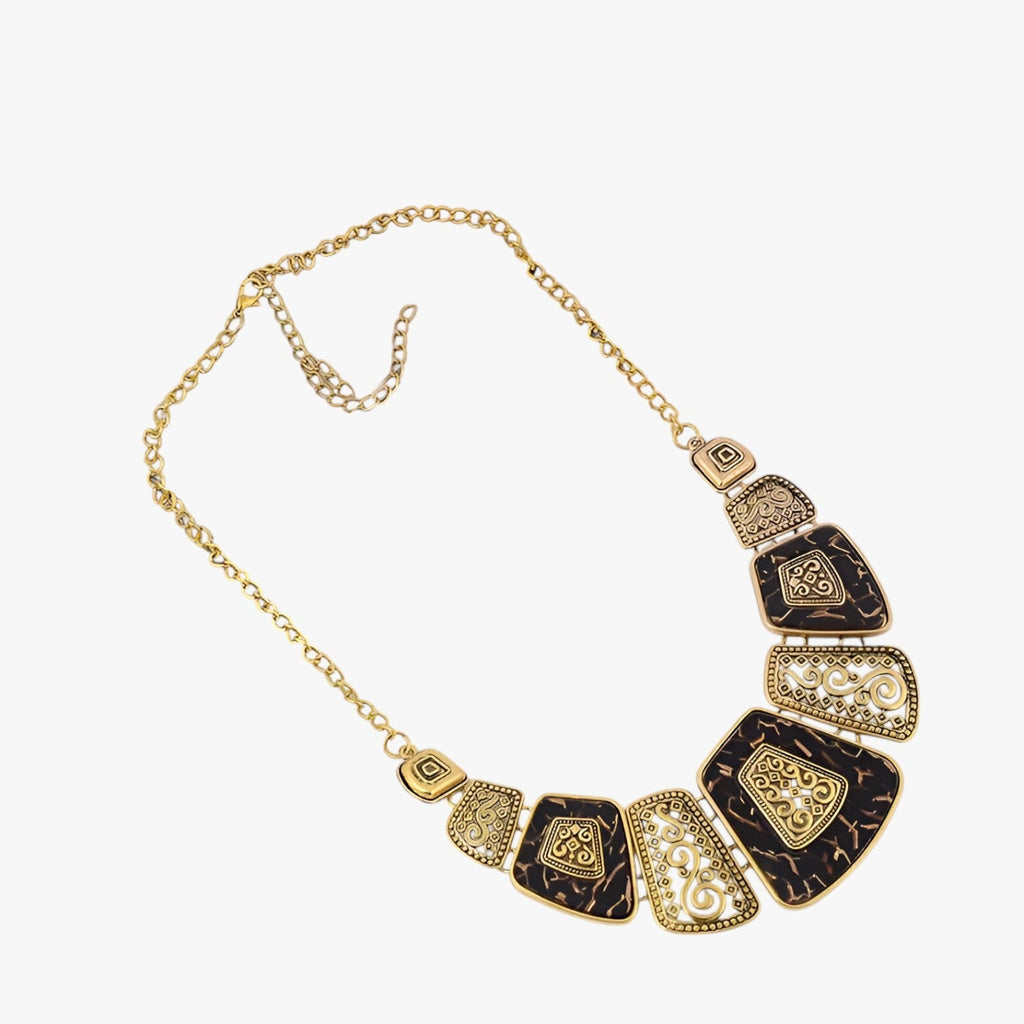 Goudkleurige statement choker met blauw detail