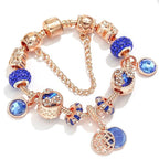 Roze zilverkleurige armband met blauw kristal