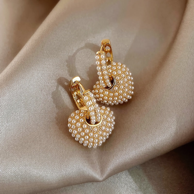 Goudkleurige liefdesoorbellen met parel