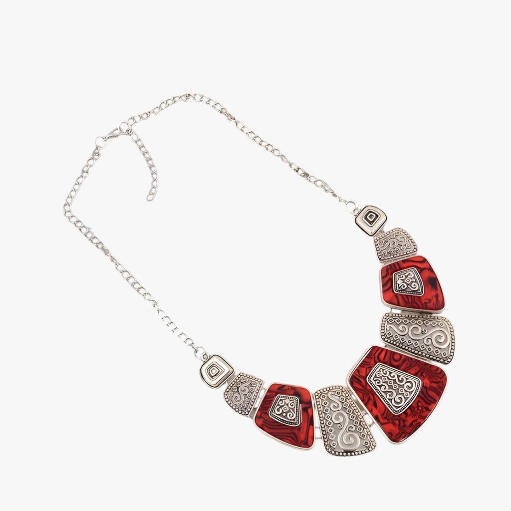 Goudkleurige statement choker met blauw detail
