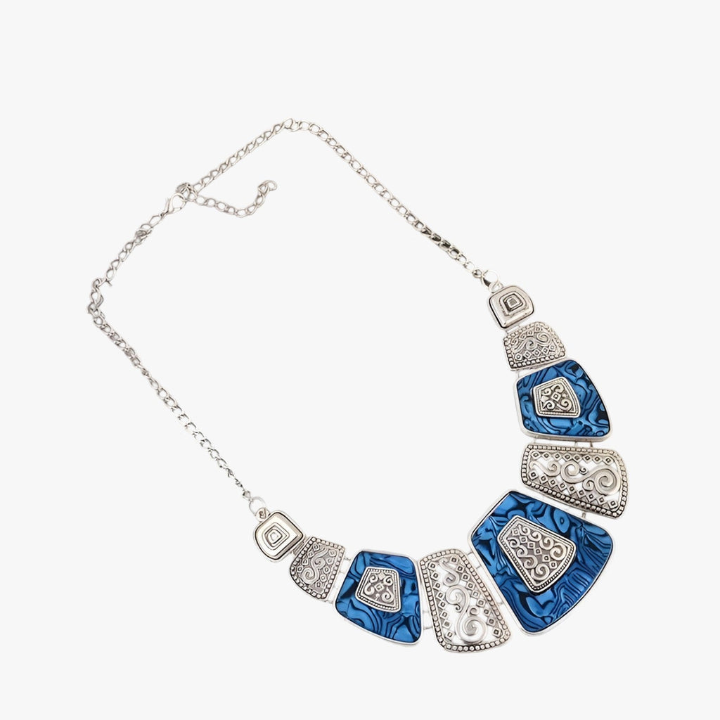 Goudkleurige statement choker met blauw detail