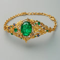 Goudkleurige armband met groen en blauw kristal