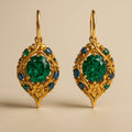 Goudkleurige oorbellen met groen en blauw kristal