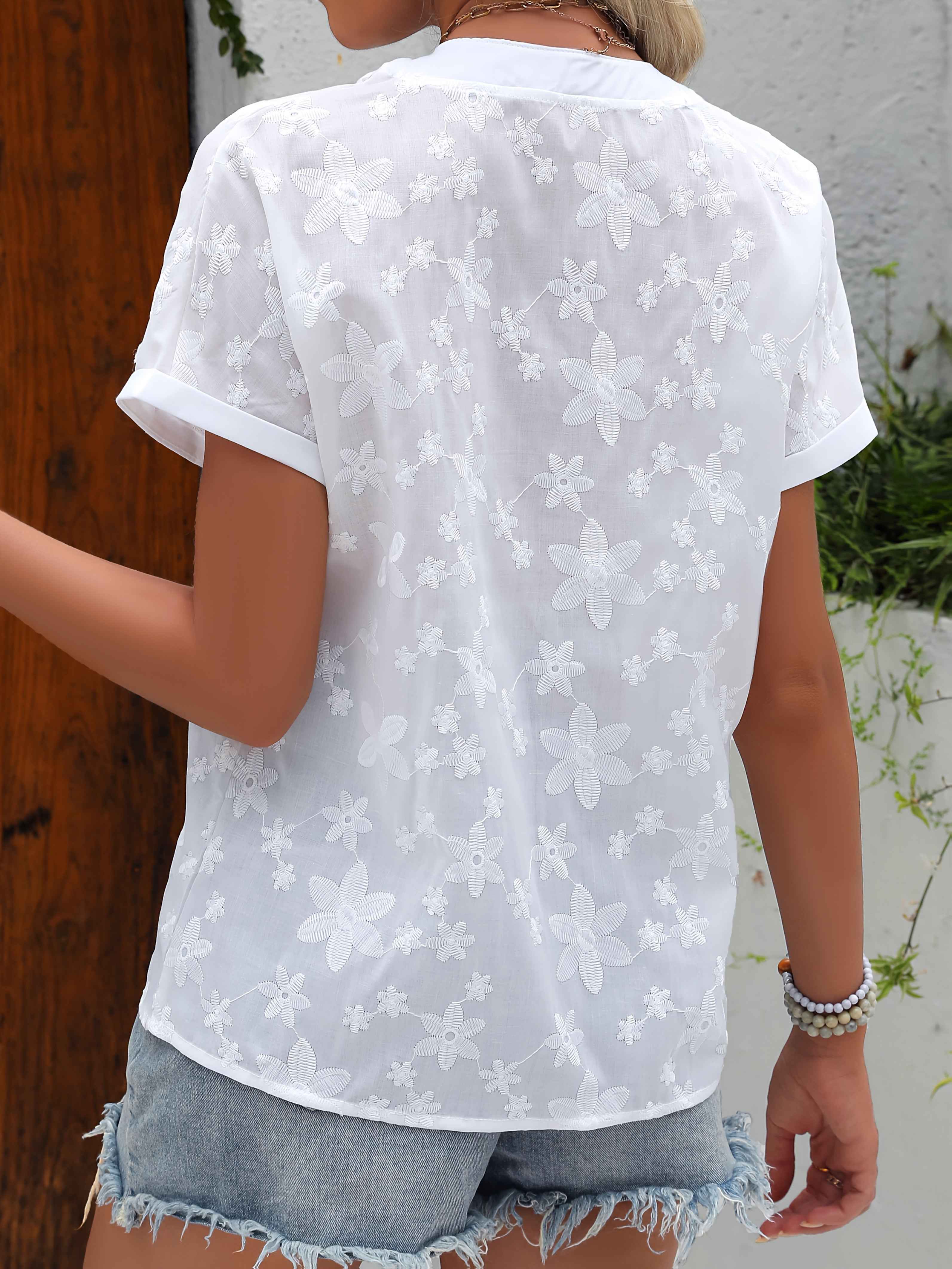 Blouse met bloemenborduursel, V-hals en knoopdetail