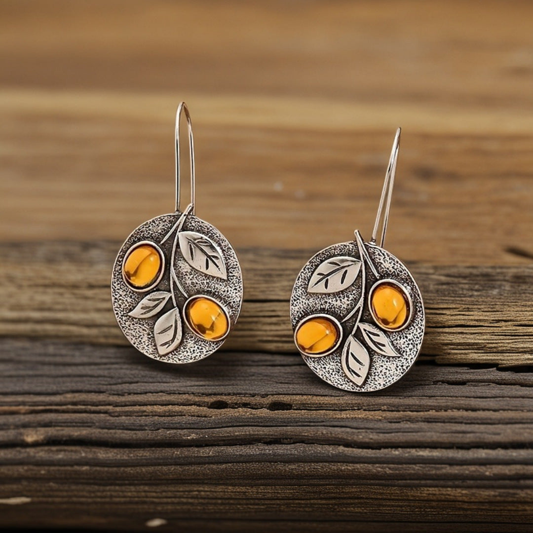 Vintage natuuroorbellen met bladschijf in amberlook